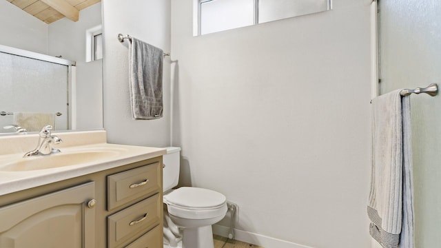 bathroom with vanity, a shower with shower door, lofted ceiling with beams, toilet, and wood ceiling