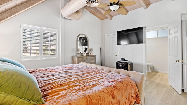 bedroom featuring ceiling fan, light hardwood / wood-style flooring, beamed ceiling, ensuite bathroom, and wood ceiling