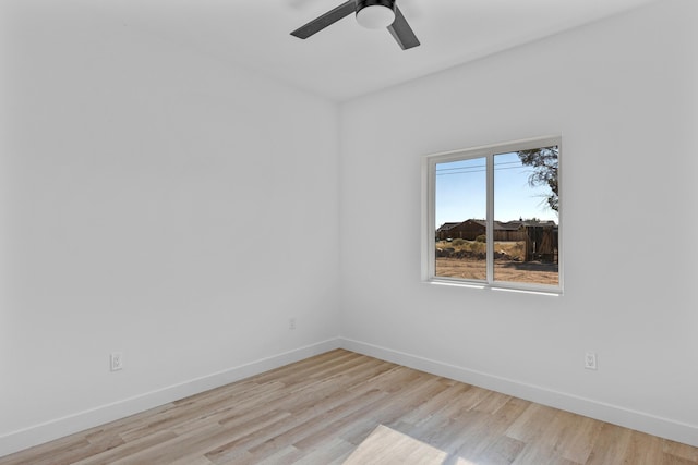 empty room with light wood-type flooring and ceiling fan