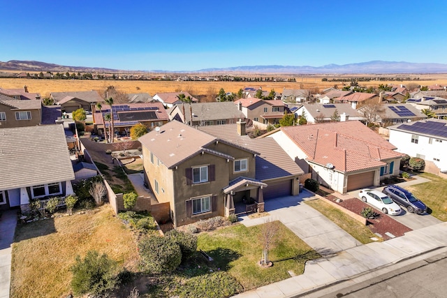 drone / aerial view featuring a mountain view