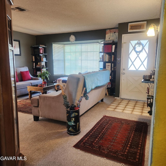 42902 Sachs Dr, Lancaster, CA 93536 - foyer entrance with carpet floors and a textured ceiling