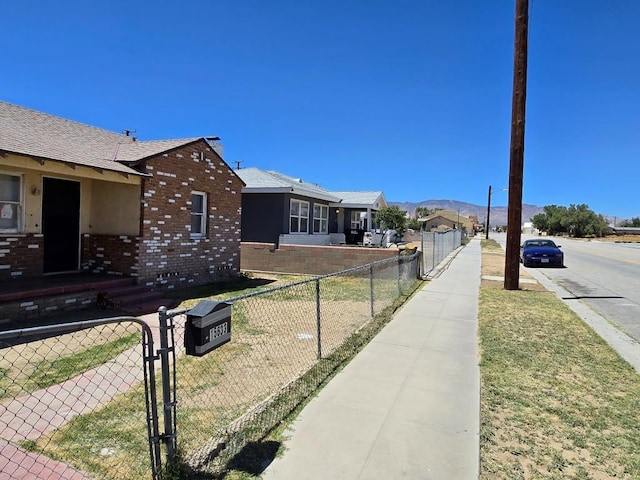 view of property exterior with a mountain view