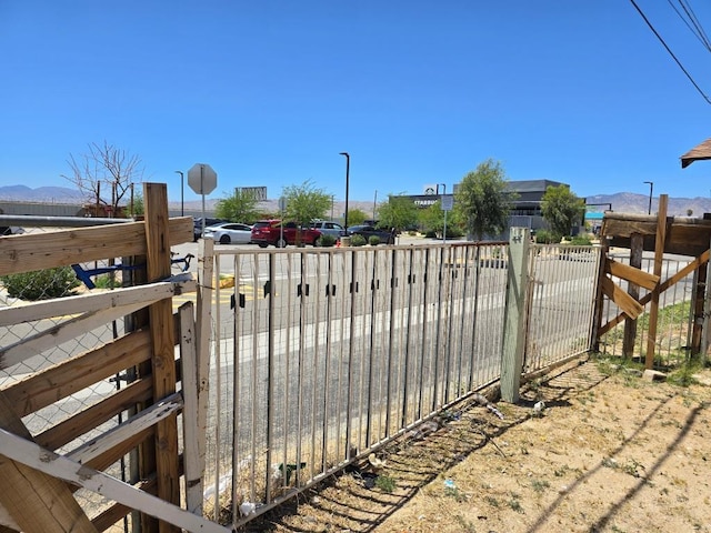 view of gate with a mountain view