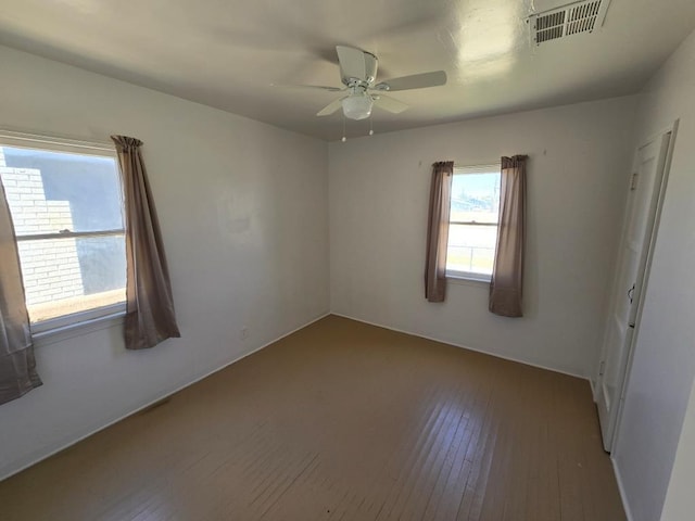 unfurnished room featuring ceiling fan and wood-type flooring