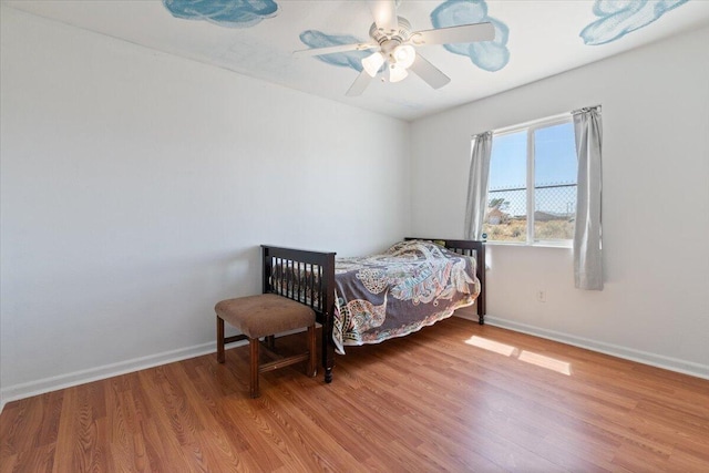 bedroom featuring ceiling fan and wood-type flooring