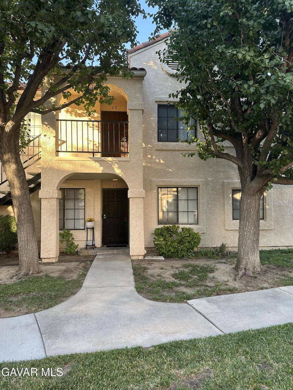 2554 Olive Dr Apt 12, Palmdale, CA 93550 - mediterranean / spanish-style home featuring a balcony and stucco siding