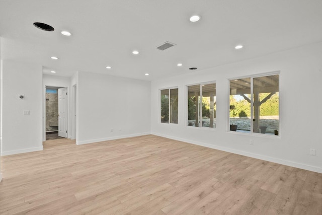 unfurnished room featuring visible vents, recessed lighting, baseboards, and light wood-type flooring