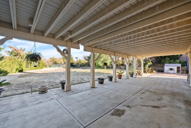 view of patio / terrace featuring an outdoor structure and a storage unit