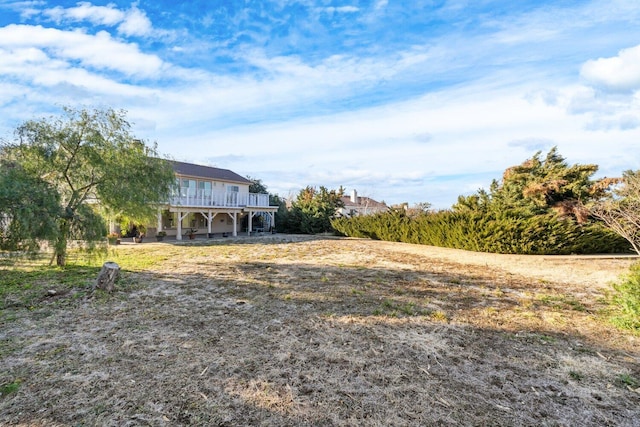 view of yard featuring stairway and a wooden deck