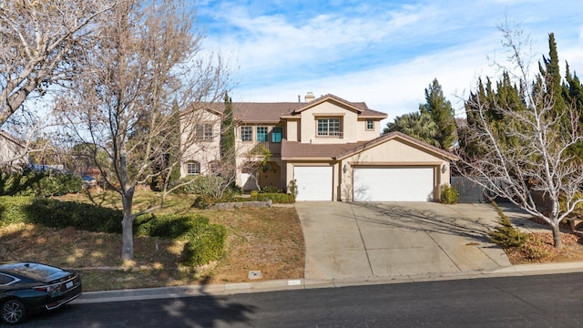 traditional home featuring a garage, stucco siding, a tiled roof, and concrete driveway