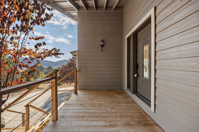 wooden terrace featuring a mountain view