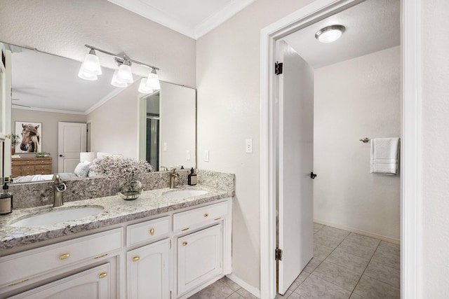 bathroom featuring crown molding, tile patterned floors, and vanity