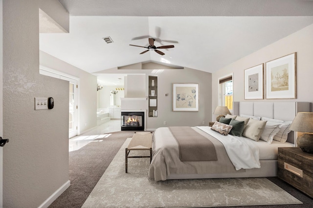 carpeted bedroom featuring lofted ceiling