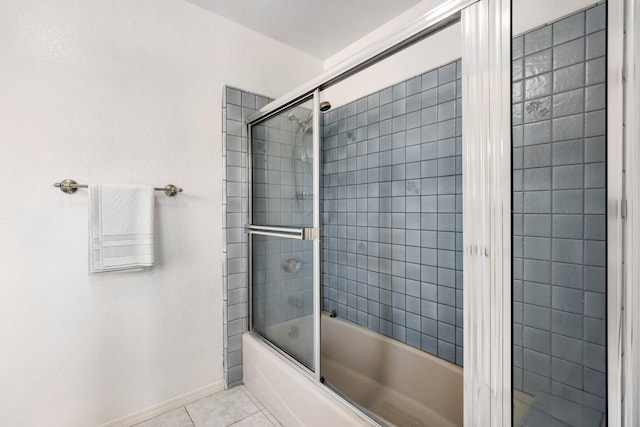 bathroom with tile patterned floors and combined bath / shower with glass door