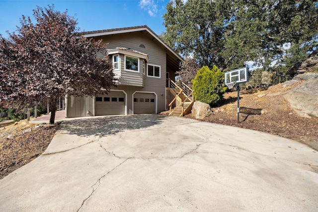 view of side of property featuring a garage