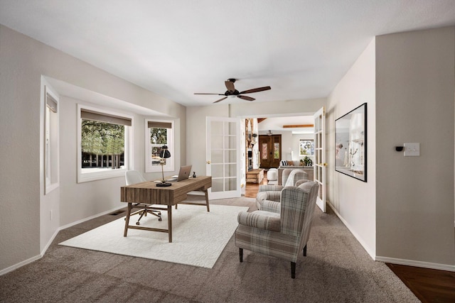 home office featuring french doors and ceiling fan