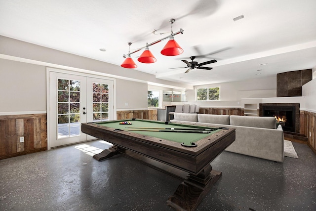 game room with french doors, billiards, and wood walls