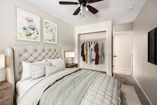 carpeted bedroom featuring a closet and ceiling fan