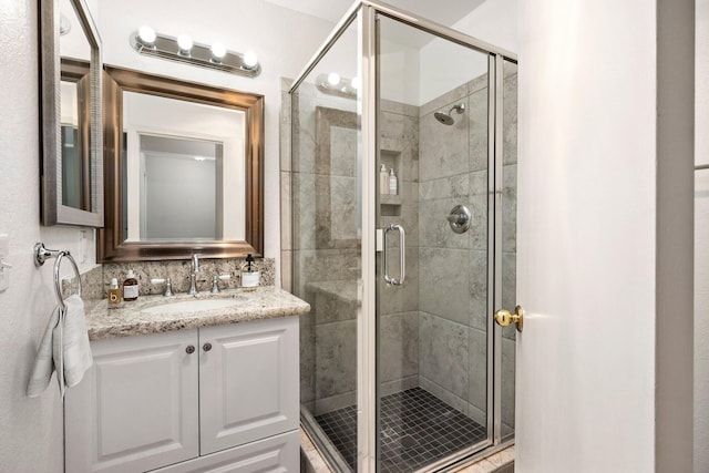 bathroom featuring vanity and walk in shower