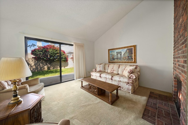 carpeted living area with a textured ceiling and high vaulted ceiling