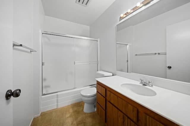 bathroom featuring bath / shower combo with glass door, vanity, toilet, and visible vents