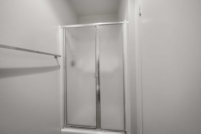 full bath with a shower with door