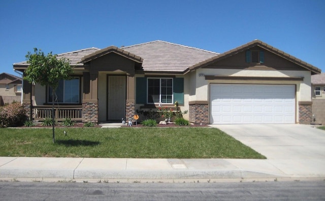 view of front of home with a porch, a garage, and a front yard