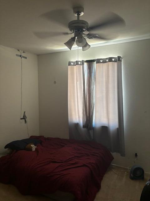 bedroom featuring carpet flooring and ceiling fan