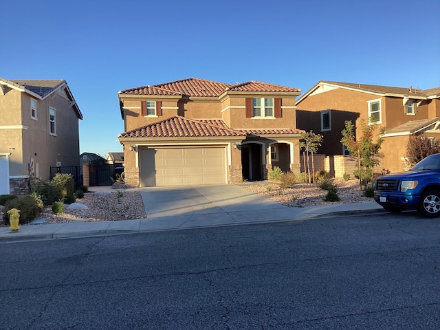 mediterranean / spanish-style home featuring a garage