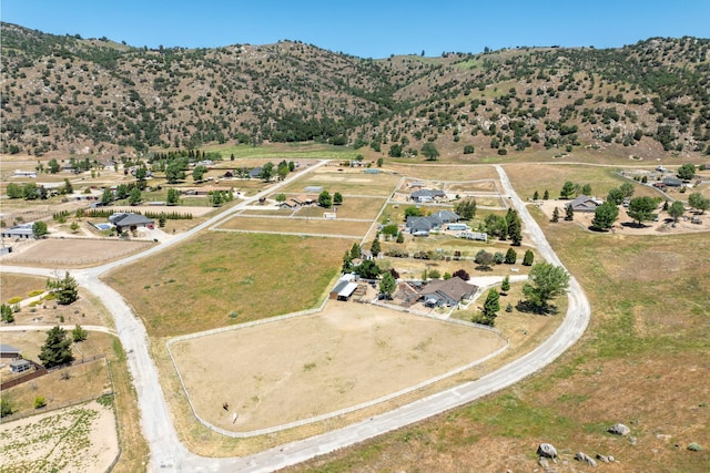 aerial overview of property's location featuring a mountain backdrop