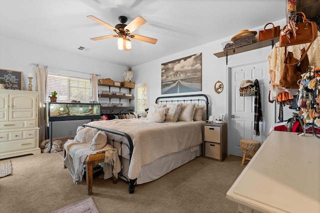 bedroom featuring light carpet and ceiling fan