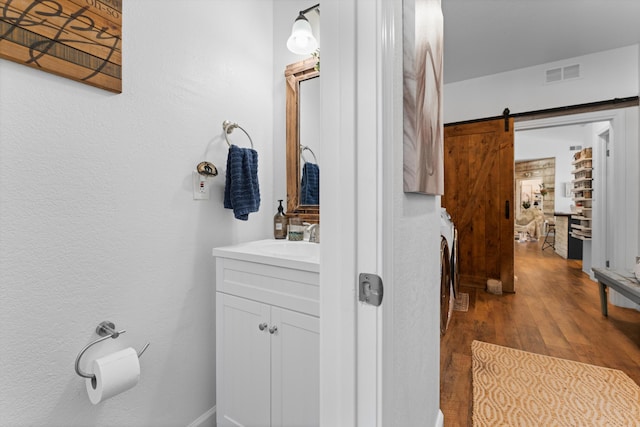 bathroom featuring wood finished floors and vanity