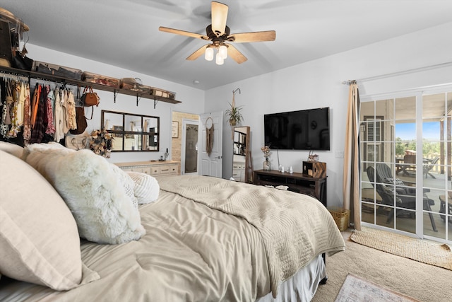 carpeted bedroom featuring access to exterior and a ceiling fan
