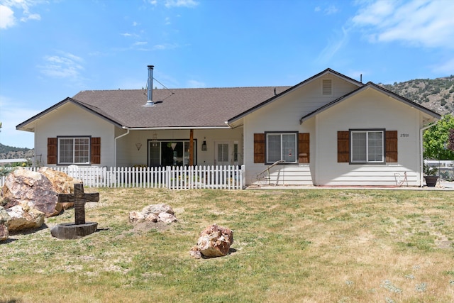 view of front of property featuring roof with shingles