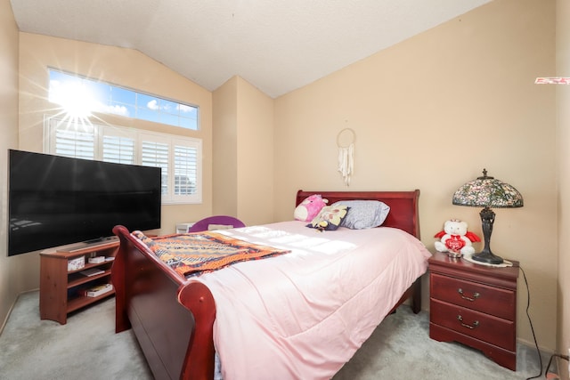 bedroom with light carpet and lofted ceiling