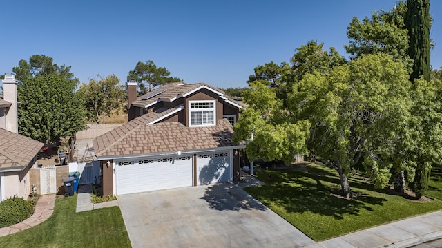 view of front property with a garage and a front lawn