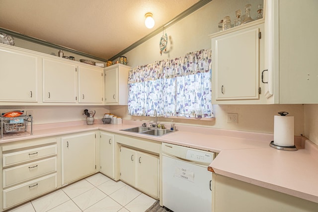 kitchen featuring a textured ceiling, white dishwasher, crown molding, sink, and light tile patterned flooring