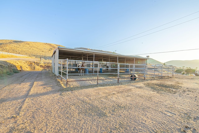 exterior space with a mountain view and a rural view