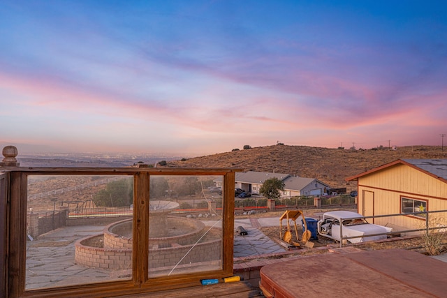 deck at dusk with a patio area