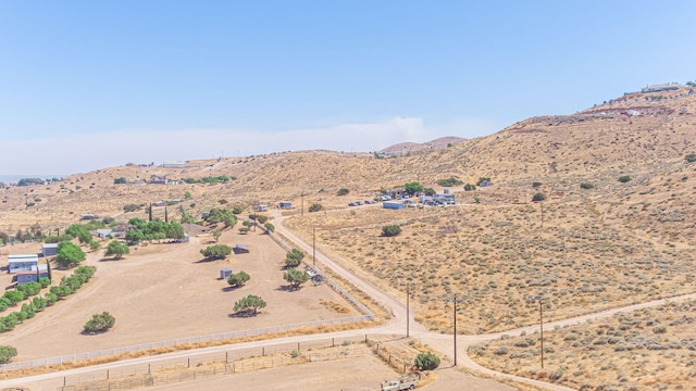 birds eye view of property featuring a mountain view and a rural view