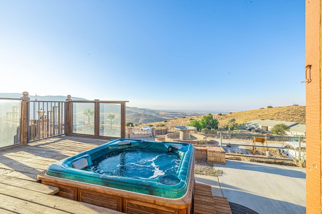 wooden deck with a mountain view