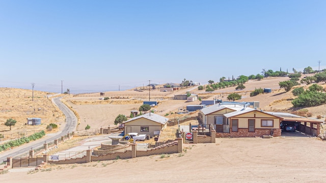 birds eye view of property with a rural view