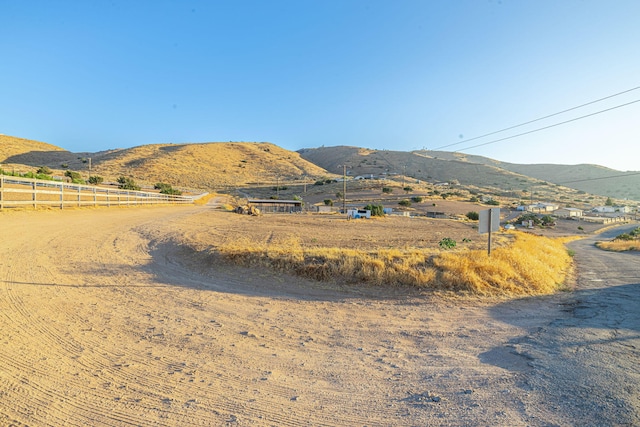 mountain view featuring a rural view