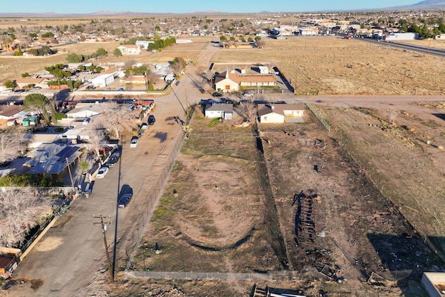 birds eye view of property with a mountain view and a residential view