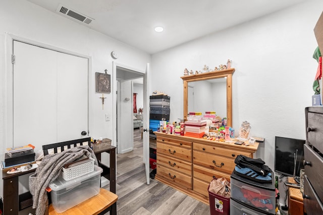 office space featuring visible vents, wood finished floors, and recessed lighting