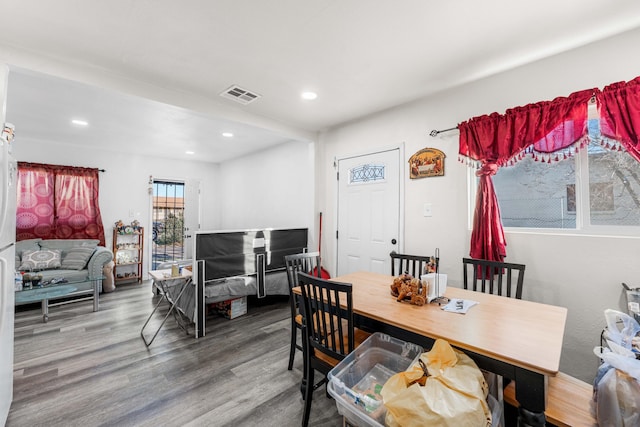 dining area featuring visible vents, wood finished floors, and recessed lighting