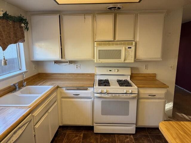 kitchen with sink and white appliances