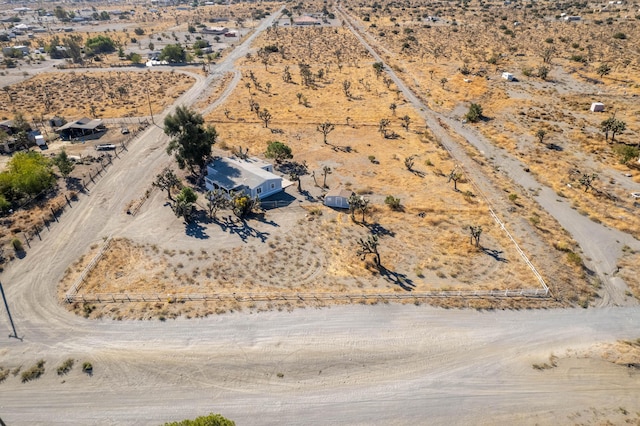 birds eye view of property with a rural view