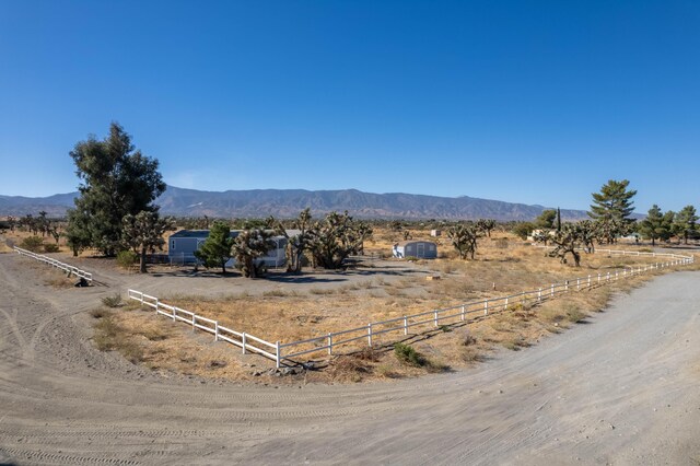 mountain view featuring a rural view