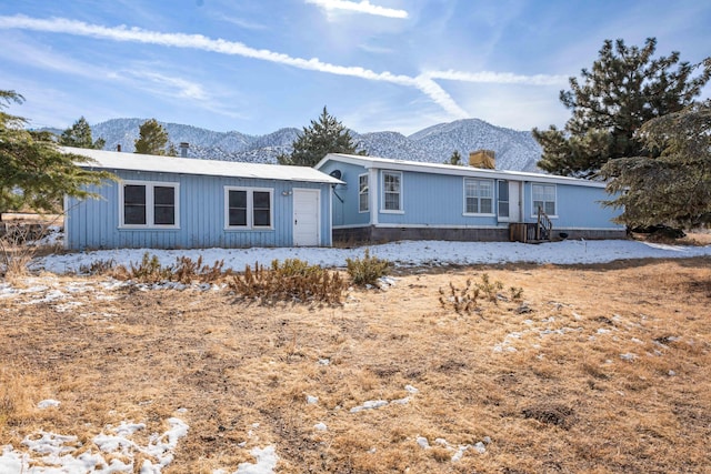 view of front of home with a mountain view